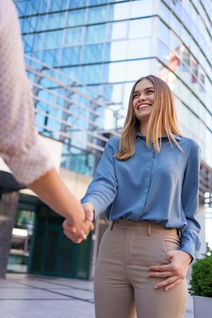 woman-hands-shake-on-business-building-background-1.jpg woman-hands-shake-on-business-building-background-1.jpg